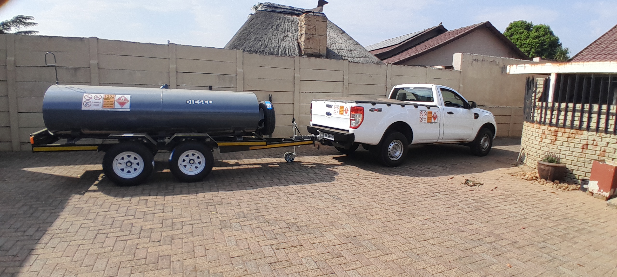 Technicians working on an outdoor standby power generator